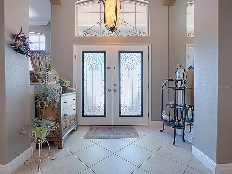BEAUTIFUL DOUBLE DOOR ENTRANCE!  CUSTOM FIXTURES THROUGHOUT! DIAGONAL TILE IN FOYER, DINING AND FORMAL LIVING ROOM!