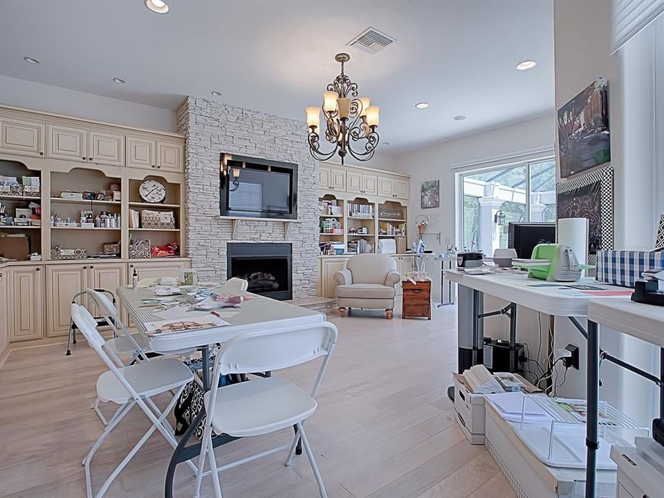 EXCUSE THE MESS BUT THAT'S WHEN YOU KNOW IT IS A USEFUL CRAFT ROOM!  THIS ROOM CAN BE USED FOR MANY THINGS!  THIS LARGE ADDITION ADDED OFF OF THE MASTER BEDROOM WITH SO MANY BUILT-IN CABINETS AND BOOK SHELVES