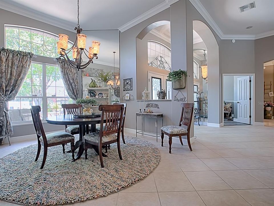 FORMAL DINING ROOM WITH LARGE WINDOWS AND TRANSOM OVERLOOKING THE COURTYARD!