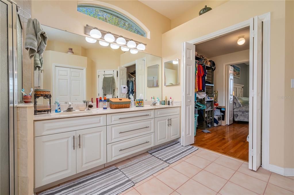 Master dual sink with easy access to the walk-in closet and bedroom