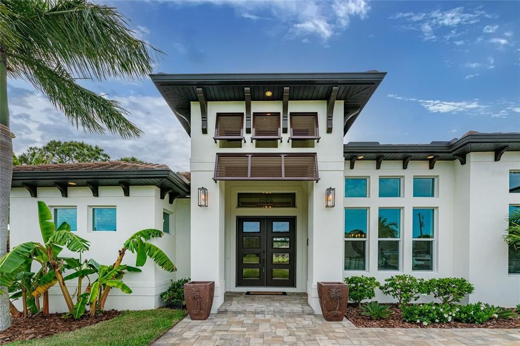 For ease of mind, this home offers impact resistant doors and windows. Bahama shutters and corbels pay homage to the home's West Indies flair.