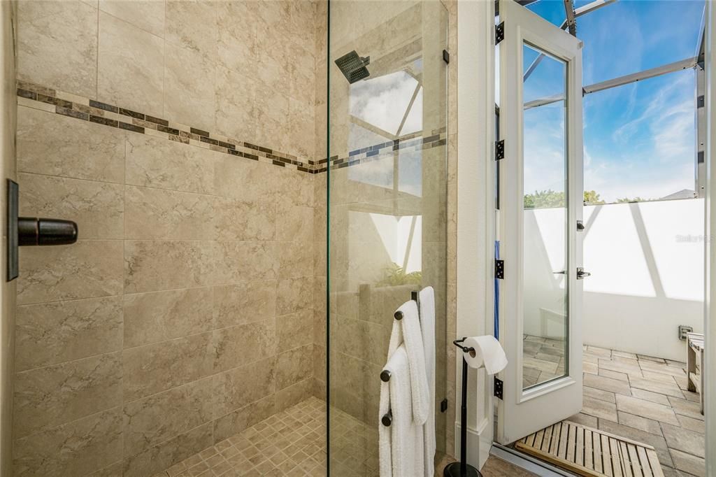 Guests may use the spacious walk-in shower with 2" glass...