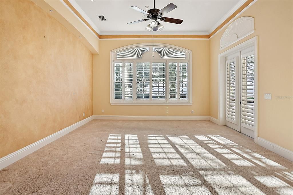 Master Bedroom with views of the lake and French Door to the pool area