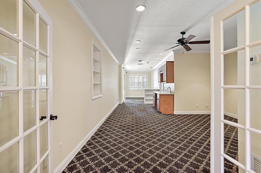 Upstairs living area with cabinets and sinks