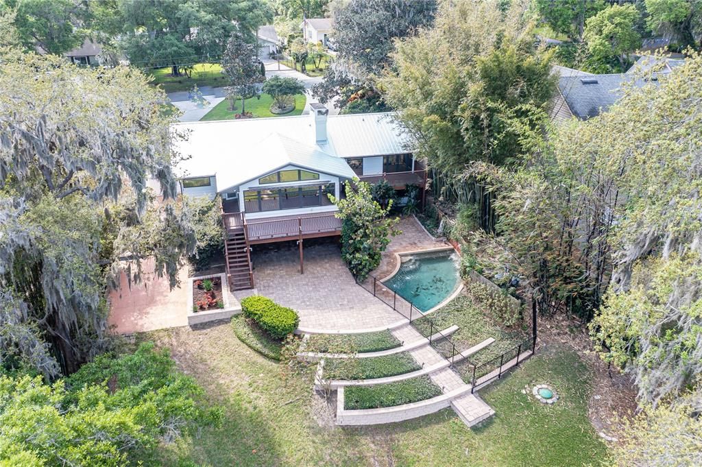 View of terraced patio and pool area