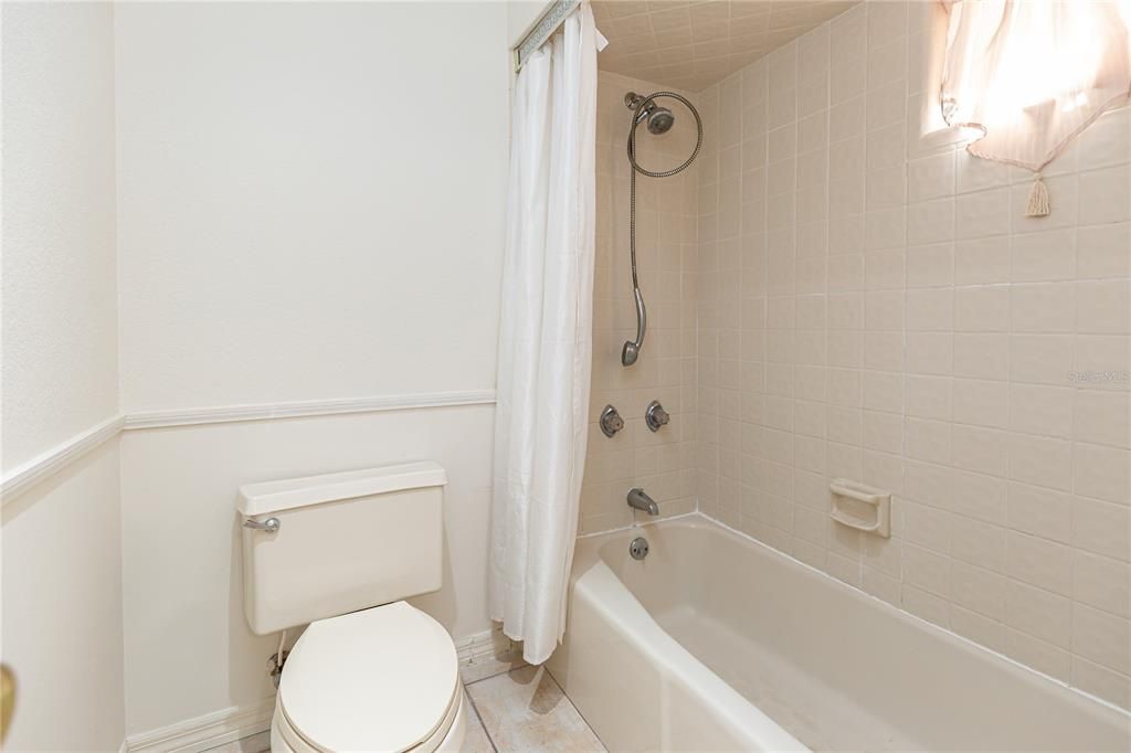 Shower/tub area of lower level full bath-
