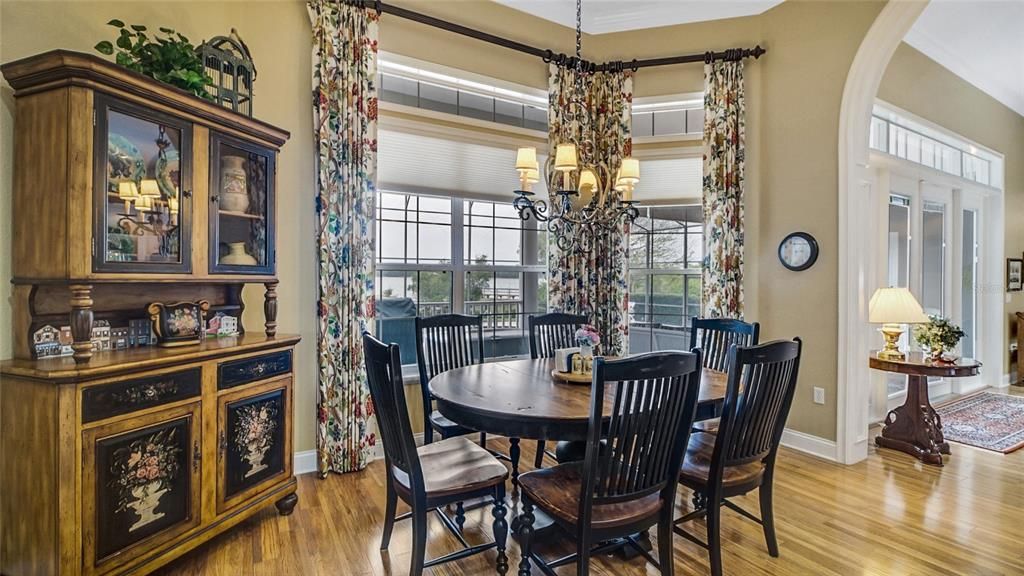 The breakfast nook is a perfect place to enjoy family meals or an afternoon cup of coffee as you look out over the pool onto the lake.