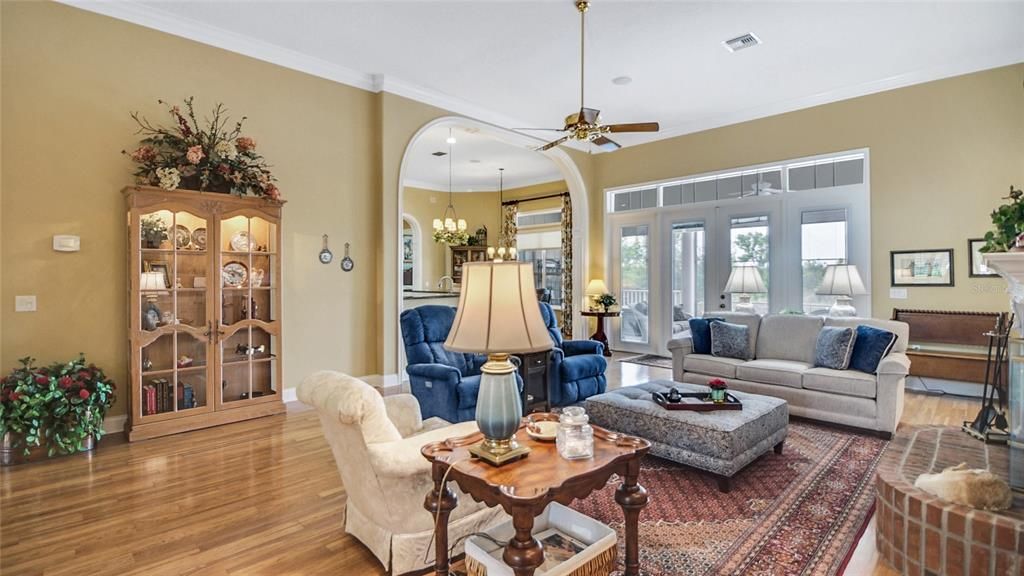 French doors on the opposite wall provide access to the covered back patio/porch and pool/lanai.