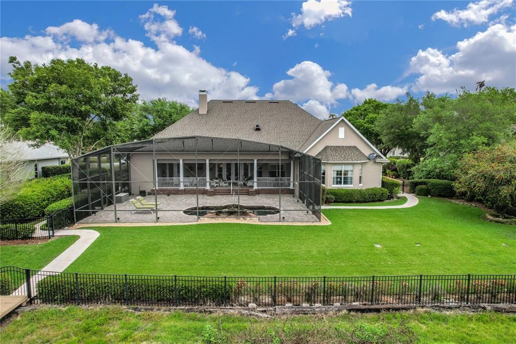 Such a beautiful yard with walkways around either side of the home to the front.