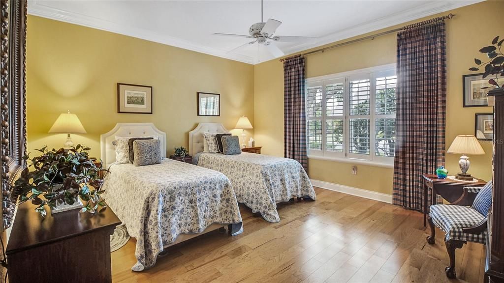 Located on the front side of the home, this guest bedroom (BR #3) has Plantation Shutters and offers ample space for larger furniture.