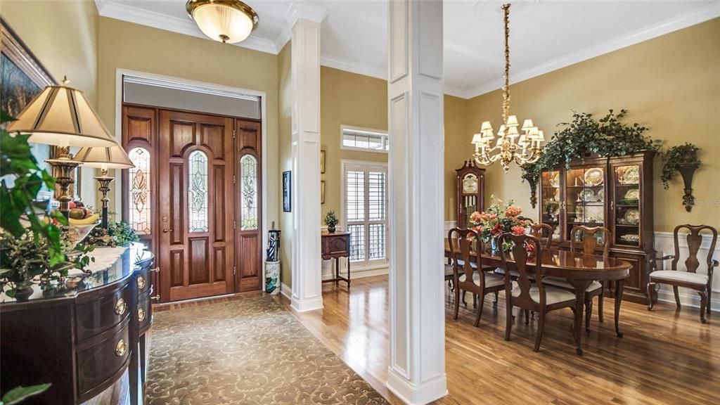 What a beautiful entry door and dining room.