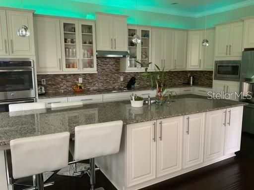 Amazing Kitchen with Granite Counters and Double Ovens