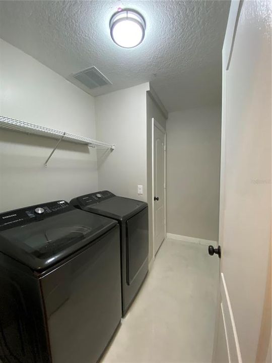 Laundry Room with Storage Closet