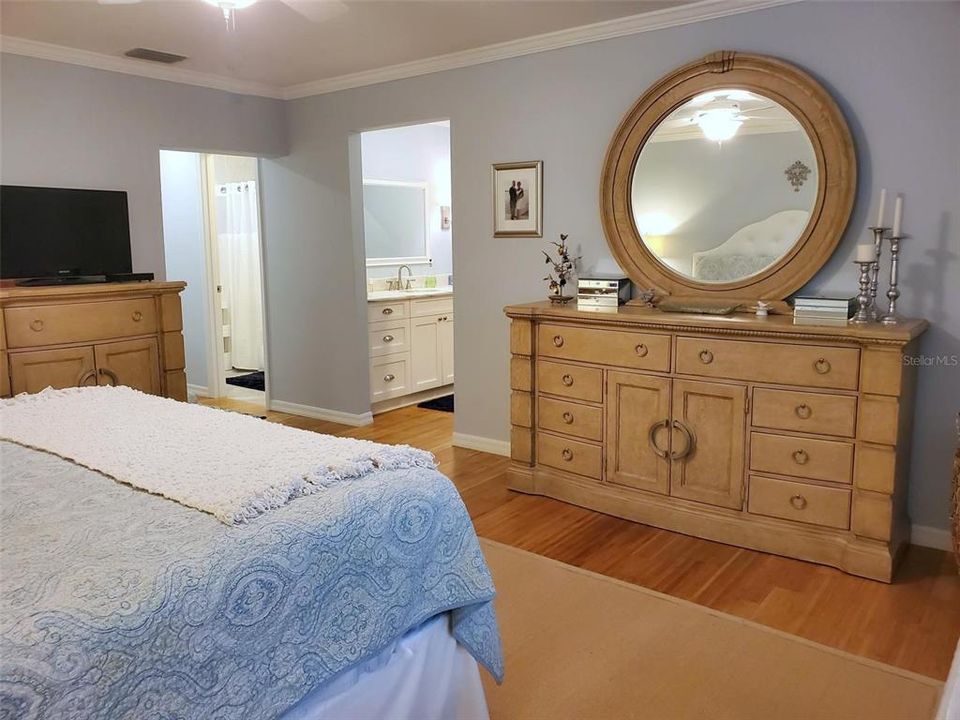 Large walk-in closet across from custom vanity. Separate room for shower, commode & linen closet~