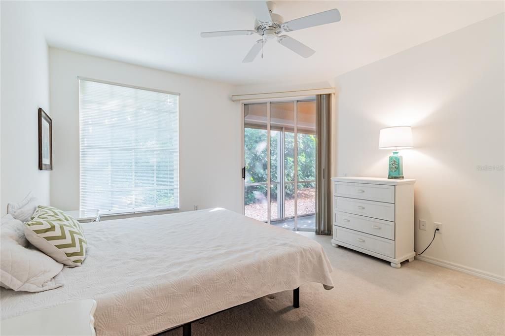 nice sized master suite with a door to the lanai