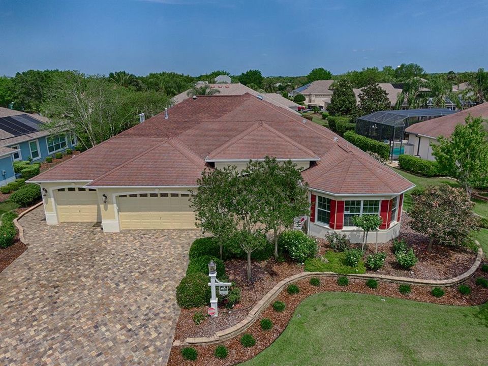 LOVELY LANDSCAPING AROUND THE ENTIRE HOME WITH PAVERED DRIVEWAY, AND WALKWAY THAT LEADS TO THE SPACIOUS OUTDOOR LIVING SPACE IN THE REAR!