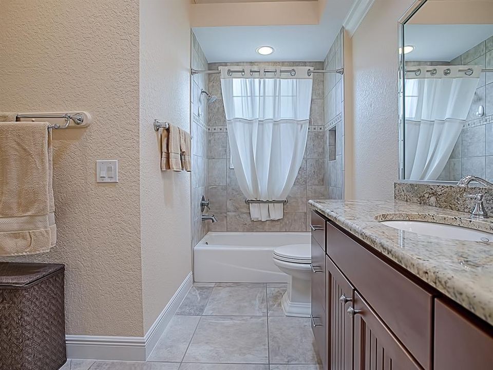 SPACIOUS GUEST BATH WITH GRANITE COUNTER TOPS, AND LOVELY TILED SHOWER WITH TUB!