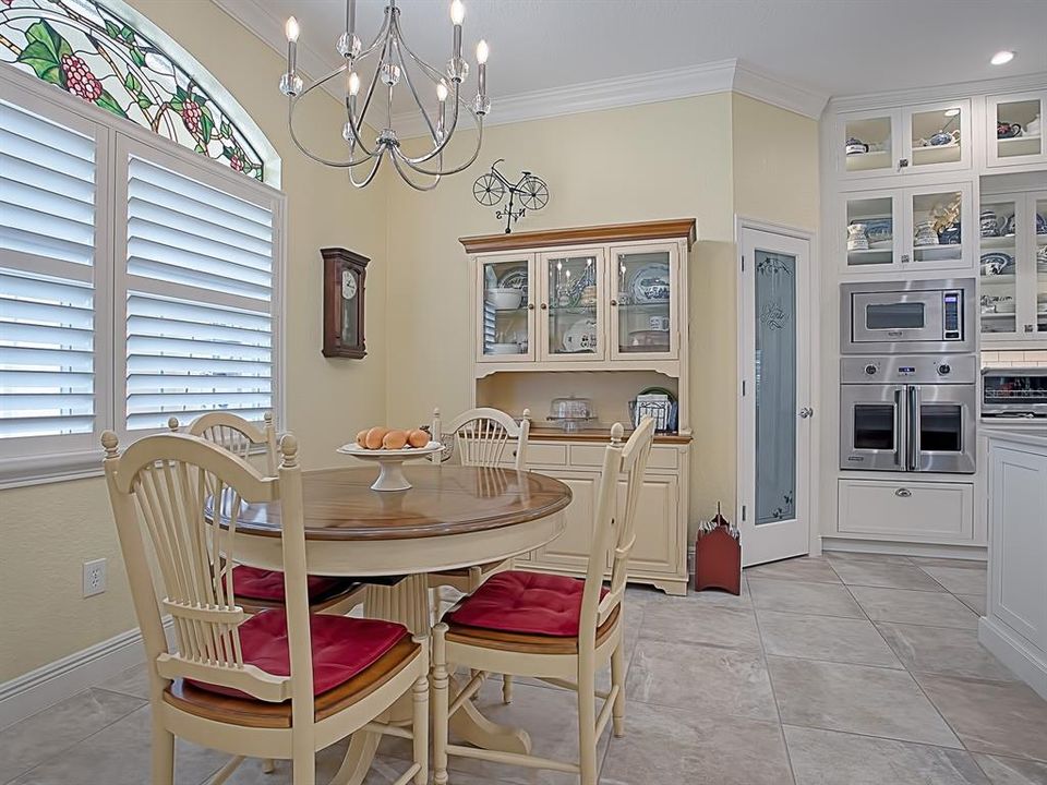 YOU CAN SEE THE LENGTH OF THE EXPANDED CUSTOM PANTRY IN THIS PHOTO! IT IS AS DEEP AS THE WALL IS LONG BEHIND THE BUFFET!