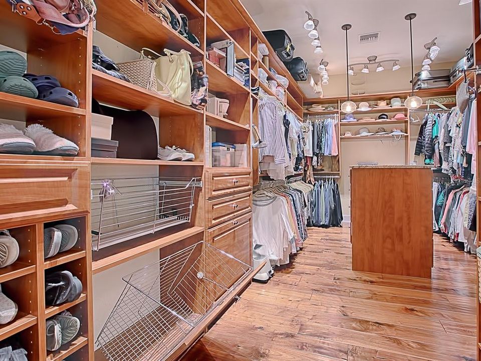 WOW! NOW THAT'S A CLOSET!  FABULOUS BUILT-INS WITH A LARGE ISLAND FOR EVEN MORE SPACE!  SO MUCH SHELF SPACE BUT PLENTY OF HANGING AREA!