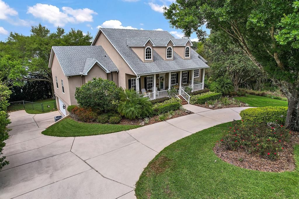 Front Exterior with Side Entry Garage, Circular Driveway with Mature Landscaping