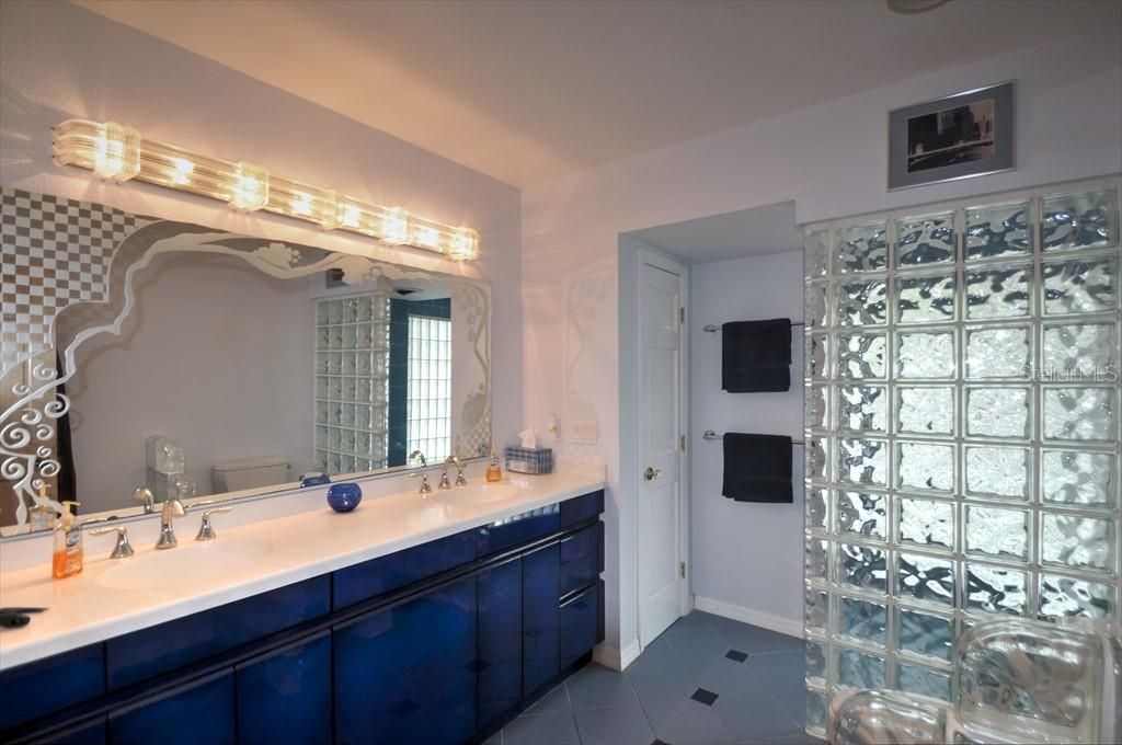 Primary Bathroom. Moon Bay Mirror. Glass Block wall leads to shower