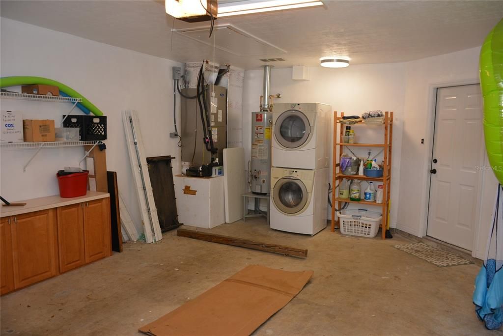 Spacious 1 1/2 car garage with laundry