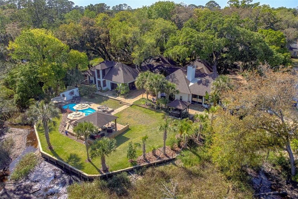 Newly reinforced retaining wall separates the property and the St. John's River canal.