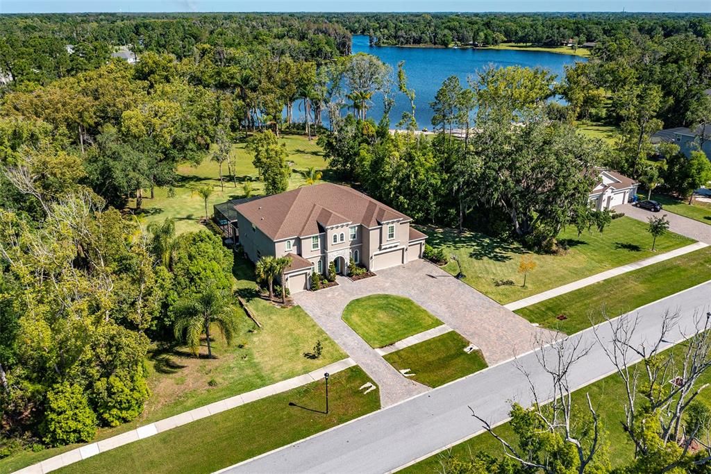 This 3-acre lakefront property only has one adjacent neighbor and so much room for toys!
