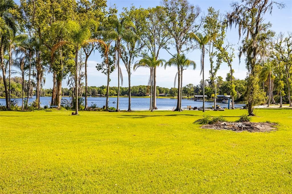 Presently the lake frontage for this property is untouched. However, it can be turned into a beach (like the neighbors have done) or a boat dock or gazebo can be added as the property extends into the lake itself.
