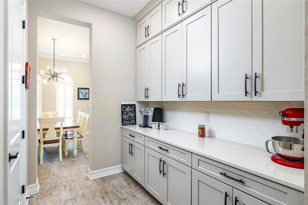 Butler's pantry is perfect for morning coffee and walk-in pantry is to the left.