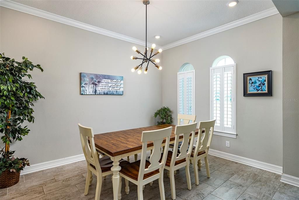 Formal dining room connects to the gourmet kitchen through the butler's pantry.