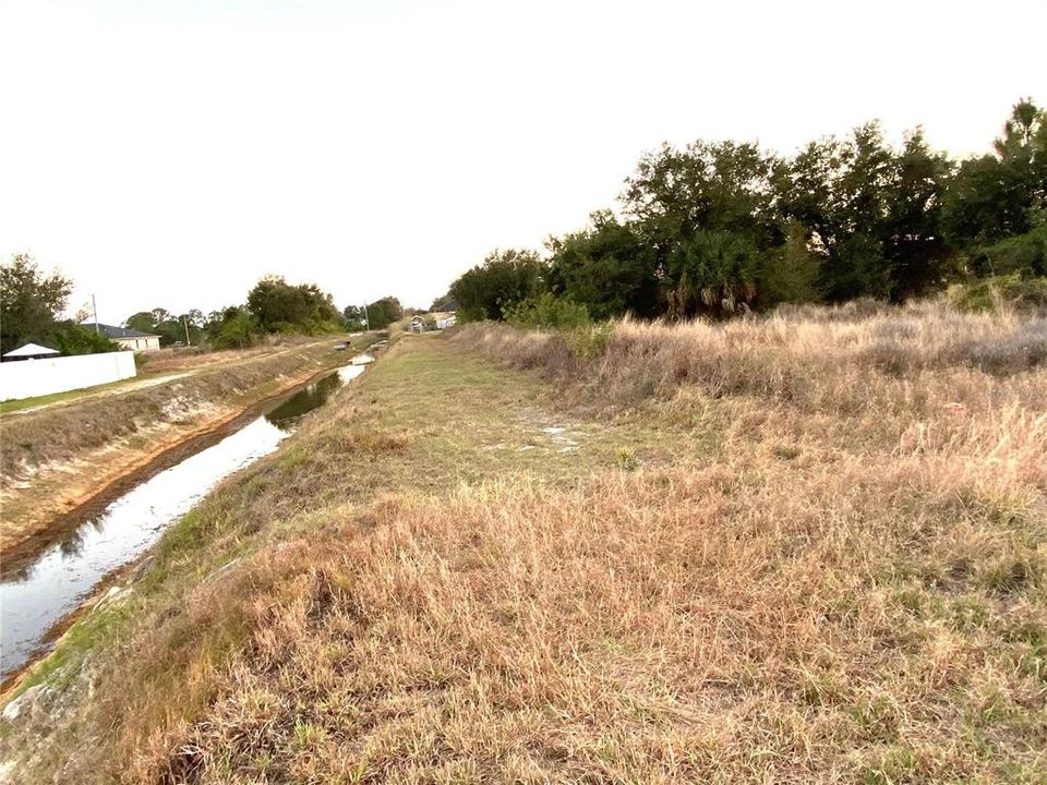 Full View of Drainage Canal running along the side of this Lot