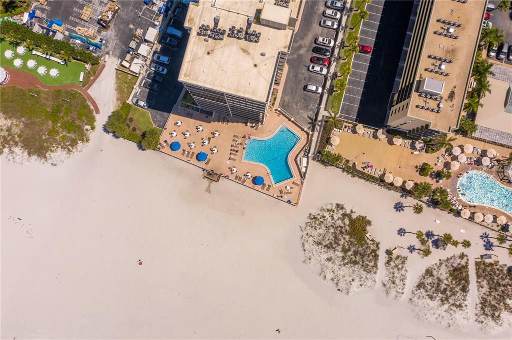 Birds-eye view of the building and pool.