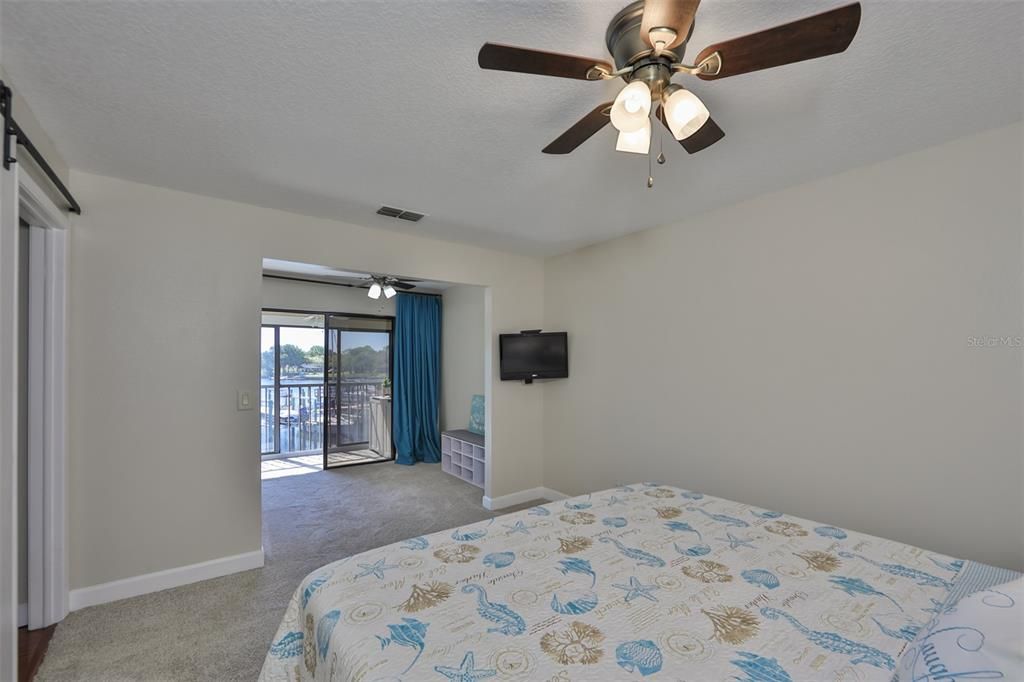 Master bedroom is HUGE with full waterfront views and an area for reading, relaxing or making an office.