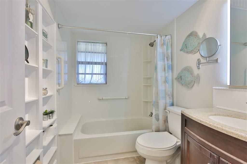 The upstairs bathroom has been outfitted by Luxury Bathrooms with a tub/shower makeover.