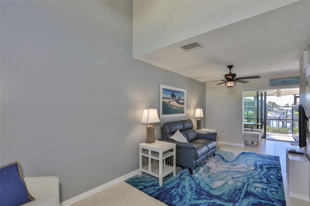 Custom light fixtures, fresh paint, coastal colors and beachy decor make this a wonderful waterfront home to relax and enjoy the sea breezes.