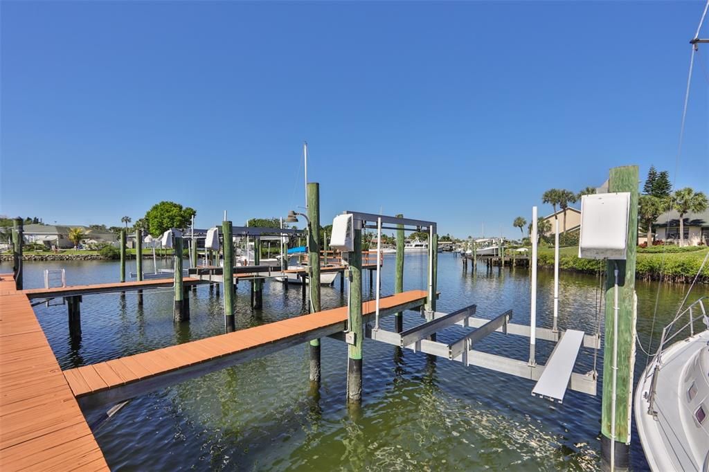 Yardarm is sought after for the DEEDED boat slip which is assigned and this one has a DECO 10,000 lb automatic boat lift installed with catwalk!