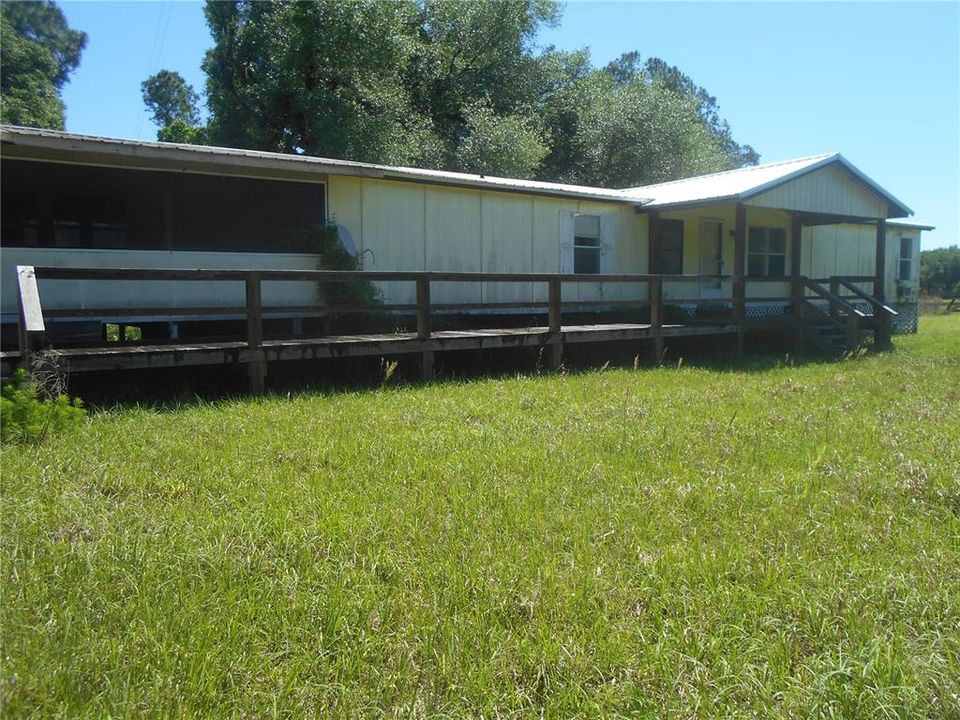 FRONT W/WOOD DECK UNCOVERED