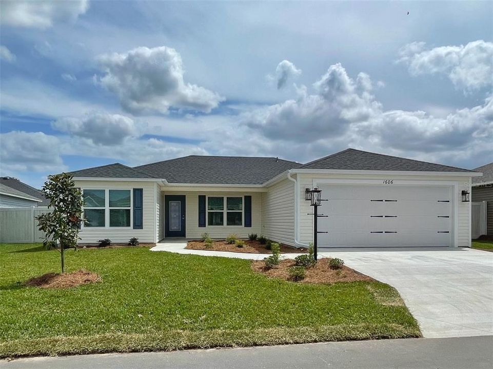 Attractive front elevation of this 3 Bedroom, 2 Bath "Sun Kissed" HOME in the Village of Hawkins with a Private fenced rear yard