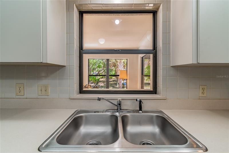 Stainless steel double sink, great view via the pass-through window