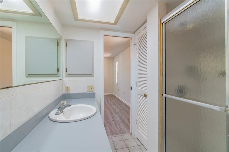 Master Bath has large vanity, and step in shower.