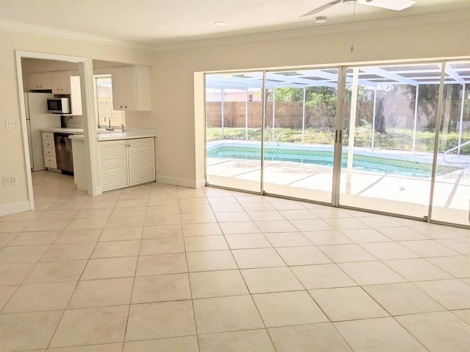 Living area looks out at pool