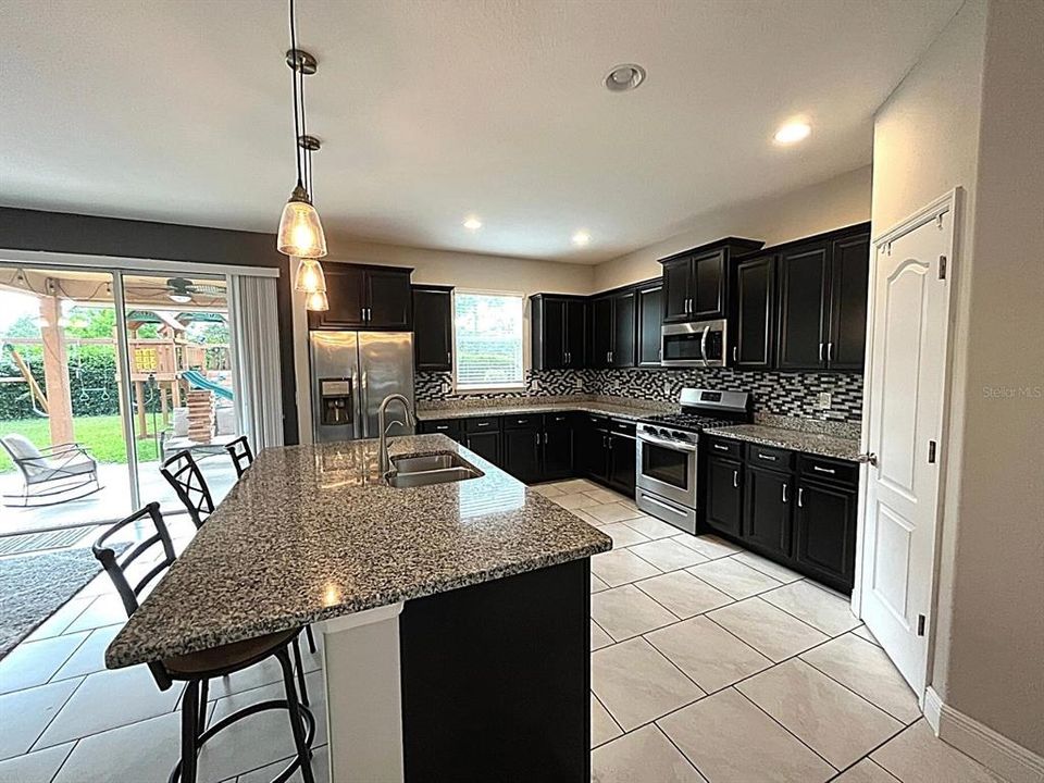 Kitchen features island and walk-in pantry