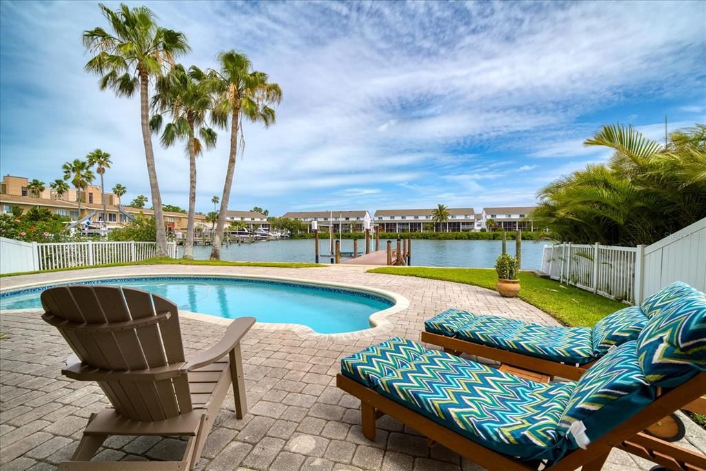 Relax poolside and enjoy the water view.