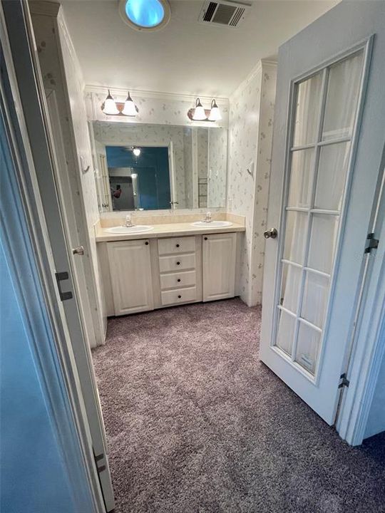 Master dressing room, walk-in shower to the left, and separate toilet room to the right.