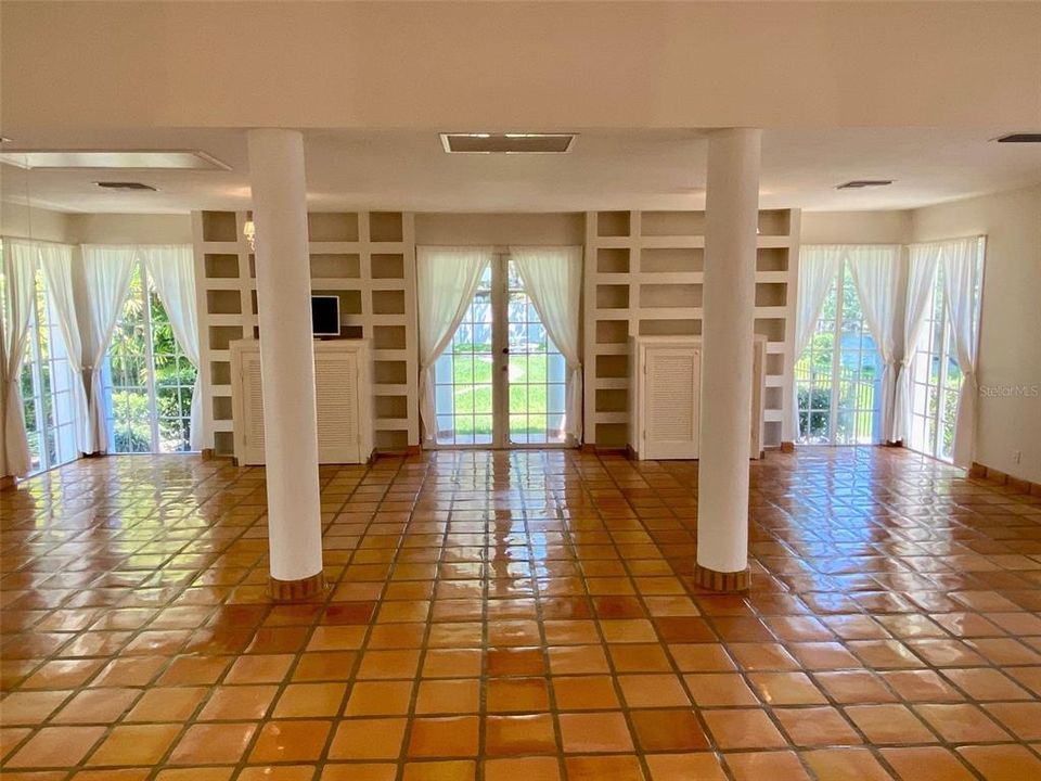 Shelves in great room Mexican tile throughout