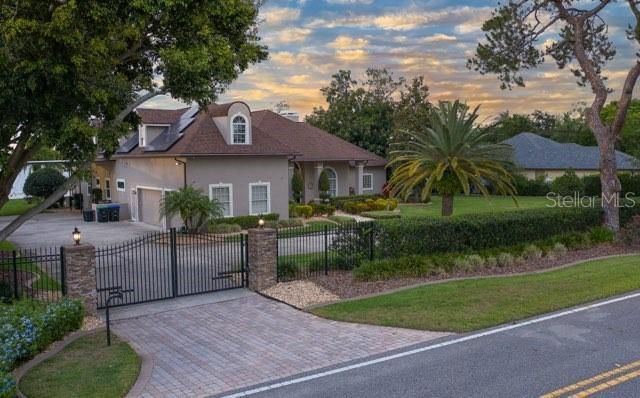 Entrance Gate with Stone Pillars and Security Camera/Remote Access