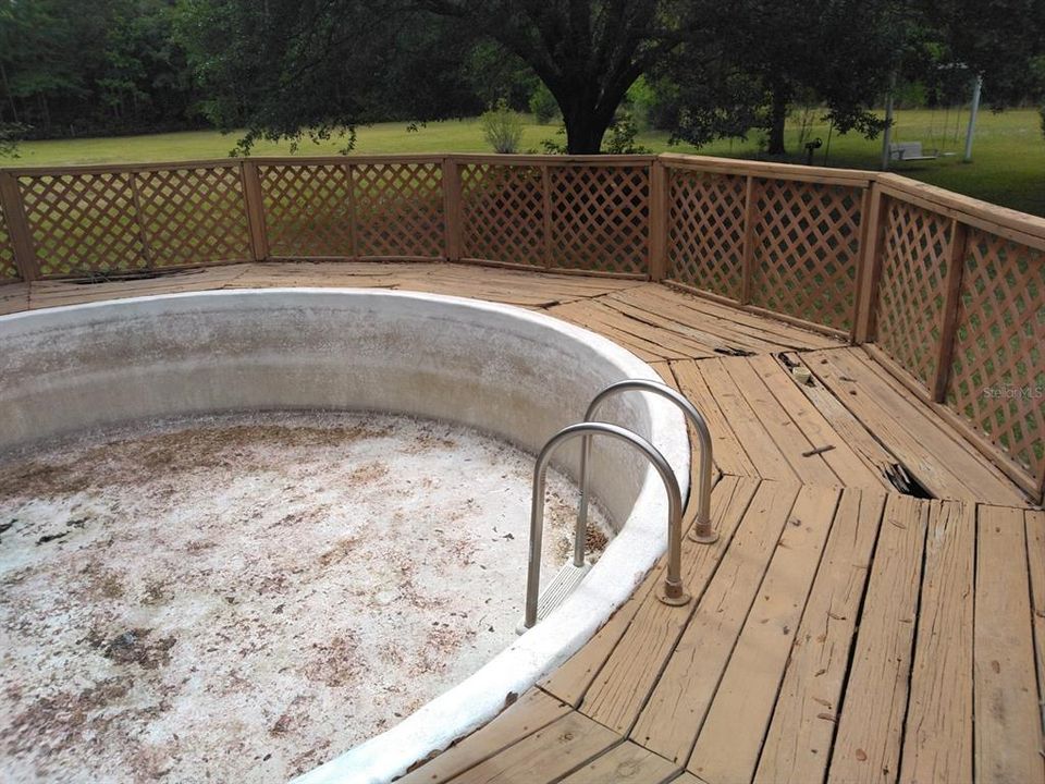 Concrete above ground pool, (bad deck boards)