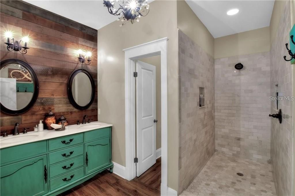 Owner's bathroom with large tiled walk-in shower