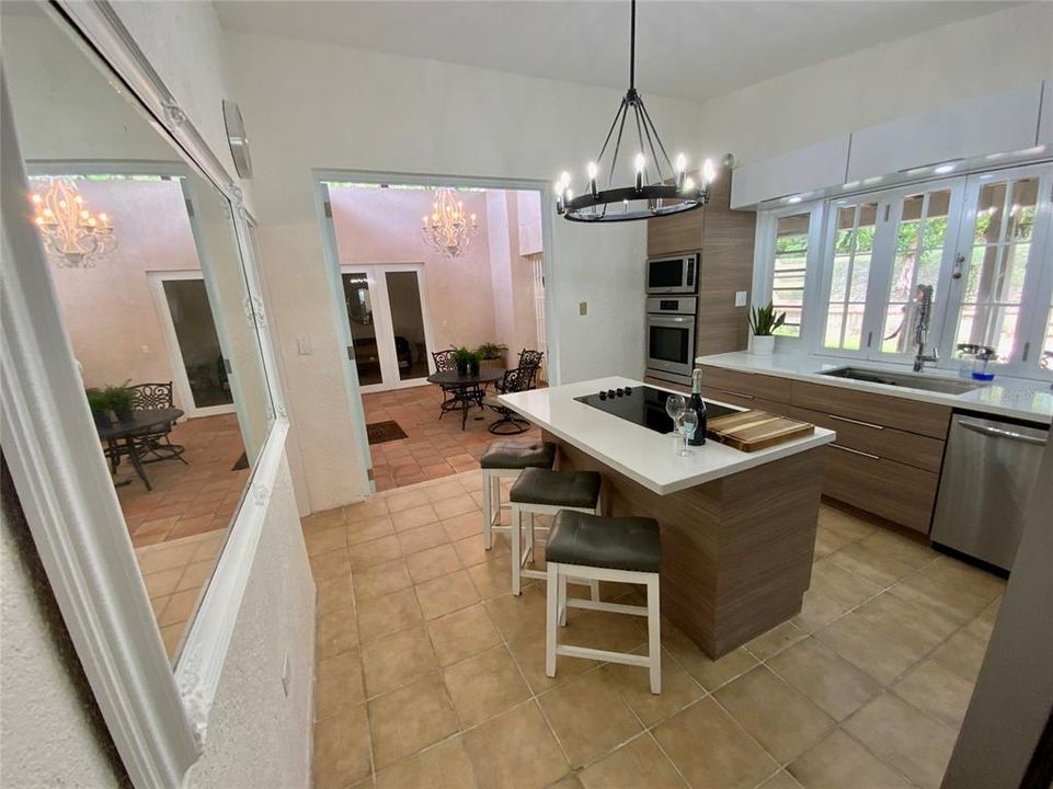 Kitchen has modern folding doors